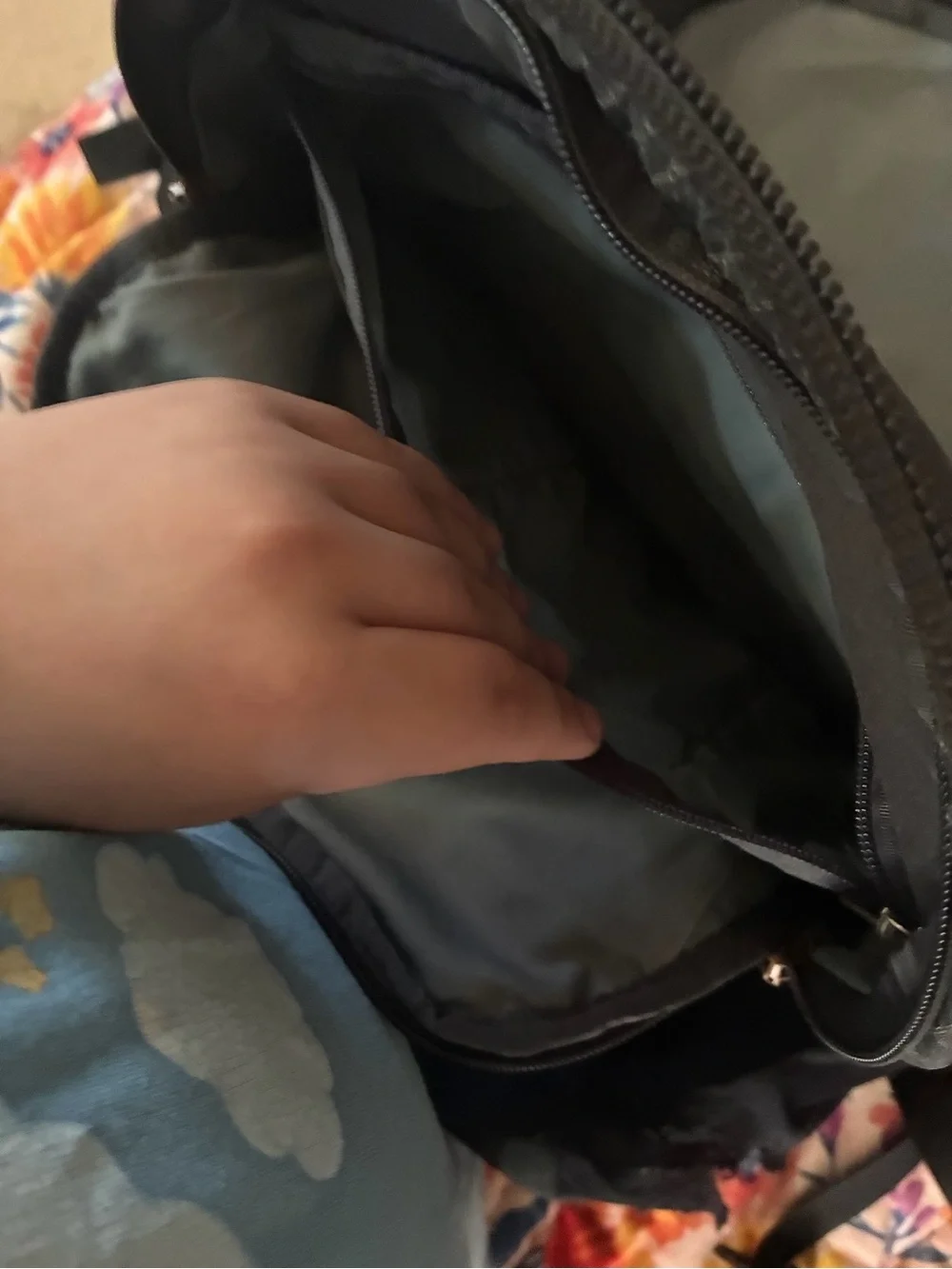 The North Face Backpack in Charcoal Gray and Black with rose gold accents